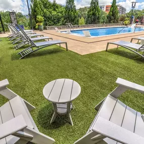 Lounge chair seating next to pool