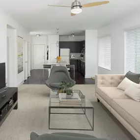 White quartz finishes in kitchen with island overlooking the living room with ceiling fan