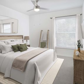 Bedroom with plush carpet and modern ceiling fan at Camden World Gateway apartments in Orlando, FL