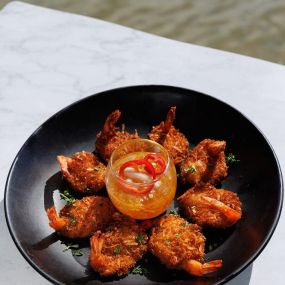 Coconut Shrimp served in a bowl  with an orange-ginger marmalade