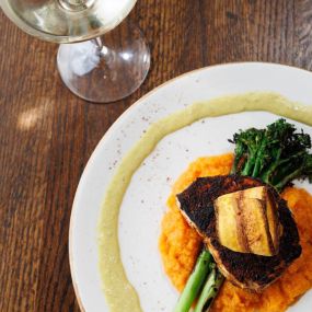 Blacked swordfish served on a bed of sweet potato puree