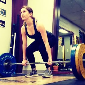 Heavy weightlifting, young woman