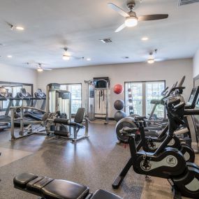 On-site gym with treadmills, weights, stationary bicycles, and other workout equipment.