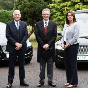 Miles & Daughters Funeral Directors vehicles and staff