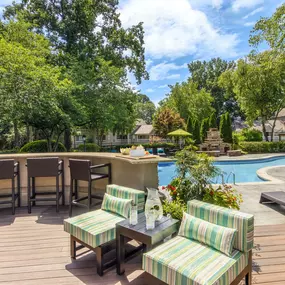 Deck area with seating next to saltwater pool at Camden Fairview in Charlotte North Carolina