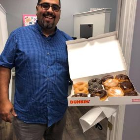 Our Customer Specialist, Elio helping us celebrate national donut day in the office!!