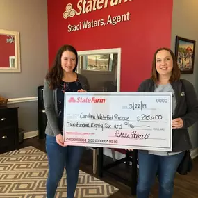 Presenting our Quotes for Good check to Julie from the Carolina Waterfowl Rescue!