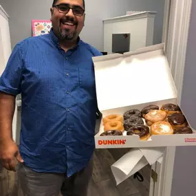 Our Customer Specialist, Elio helping us celebrate national donut day in the office!!