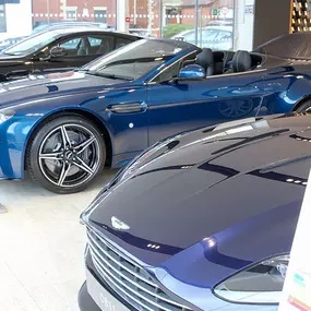 Cars inside the Aston Martin Wilmslow dealership