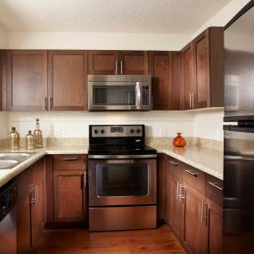 Kitchen with energy efficient stainless steel appliances including microwave