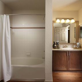 Bathroom with large bathtub in traditional finish style at Camden Doral apartments