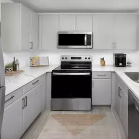 Apartment home kitchen with modern finishes at Camden Doral in Doral Florida