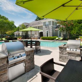 Barbeques and outdoor dining alongside pool