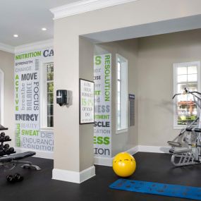 Fitness center with strength training equipment and free weights