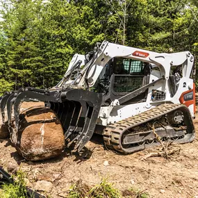 A tracked Bobcat T86 with planer attachment