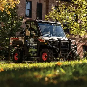 A Bobcat L28 small articulated loader with bucket attachment