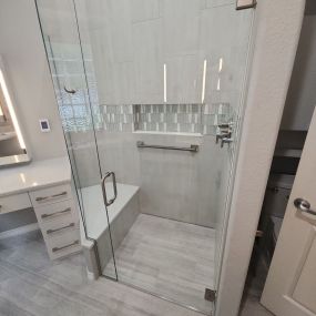 Beautiful grey and white bathroom with heated floors and seat!