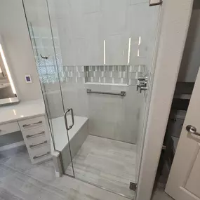 Beautiful grey and white bathroom with heated floors and seat!