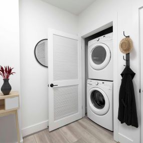 Full-size, stackable washer and dryer in penthouse apartment home at The Camden in Hollywood, CA