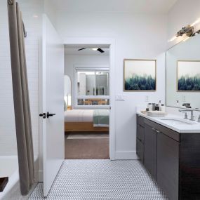 En suite bath with spacious countertop in penthouse apartment home at The Camden in Hollywood, CA