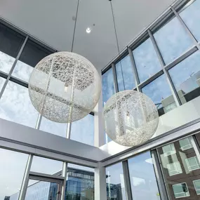 22-foot ceilings with unique lighting fixtures in penthouse apartment homes at The Camden in Hollywood, CA