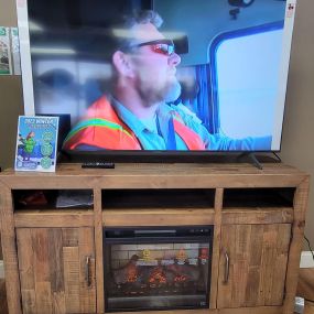 Samsung smart tv with Fireplace tv stand.