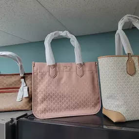 Handbags from Michael Kors and Coach