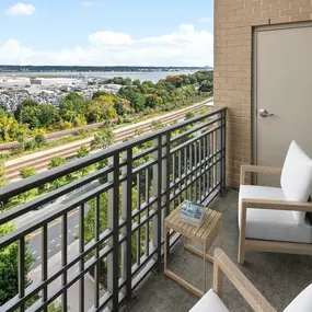 Private balcony with space for outdoor furniture at Camden Potomac Yard Apartments in Arlington, VA.