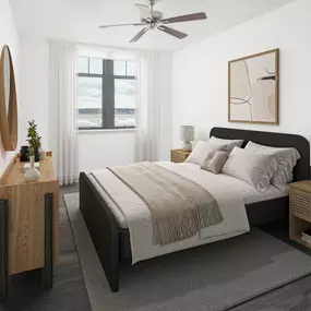 Bedroom with hardwood-style flooring and ceiling fan at Camden Potomac Yard Apartments in Arlington, VA.