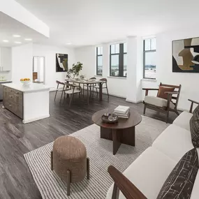Penthouse great room, open-concept living room, dining area, and kitchen at Camden Potomac Yard apartments in Arlington, VA