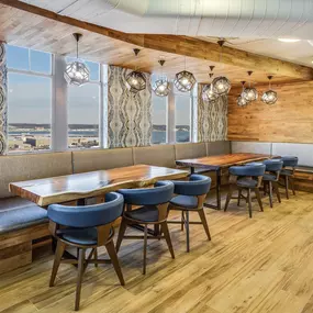 Resident lounge with additional lounge seating overlooking Washington National Airport at Camden Potomac Yard in Arlington, VA.