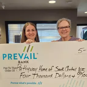 Prevail Bank charitable contribution 'big check' to local homeless shelter, Pathway Home.