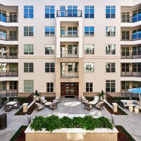 Outdoor center courtyard with lounge areas and grills