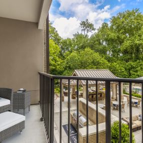 Balcony overlooking pool courtyard and 18th hole of Carolina Country Club