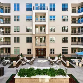 Outdoor center courtyard with lounge areas and grills