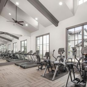Fitness center with cardio equipment at Camden Woodson Park in Houston, TX