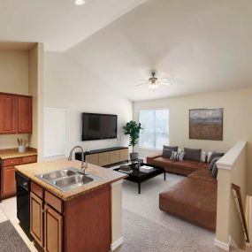 Kitchen opens to large living room at Camden Woodson Park in Houston, TX