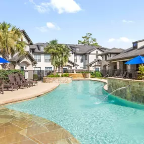 Resort-style pool with fountains at Camden Woodson Park in Houston, TX