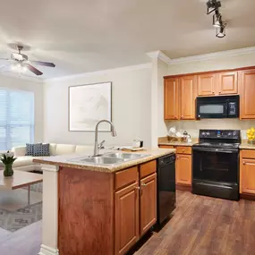 Open kitchen and living room at Camden Woodson Park in Houston, TX