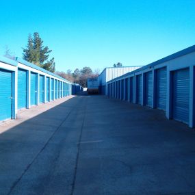 View of wide aisle between storage buildings at Sentry Storage 4041 Wild Chaparral Dr