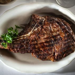Sizzle and Flavor Unleashed! Our skilled chefs expertly cook bone-in steaks to perfection.