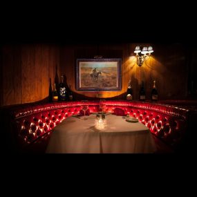 Cozy Up in Style! Enjoy an intimate dining experience in our classic corner booth at Golden Steer Steakhouse.