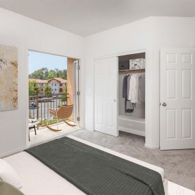 Townhome bedroom with spacious closet and private patio