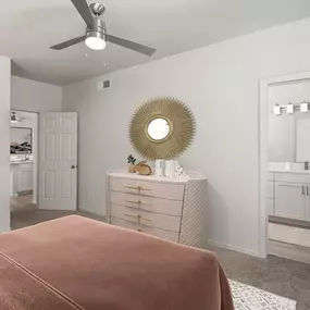 Bedroom with ensuite bathroom and ceiling fan