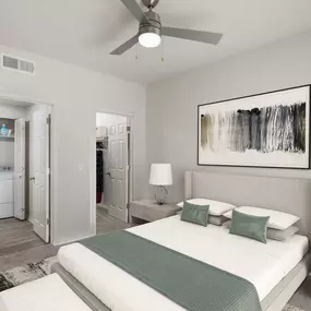 Main bedroom with ensuite walk-in closet and ceiling fan