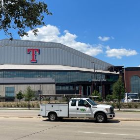 The Globe Life Field building and a Tioga service truck in Arlington Texas.