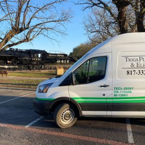 One of the Tioga Plumbing & Electric vans in front of the Spirit Of Cleburne train in Cleburne Texas.