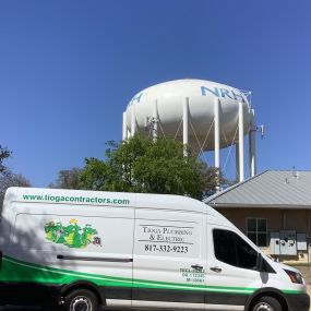 A Tioga service truck at the NRH water tower in North Richland Hills Texas.