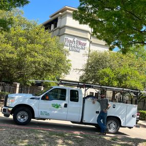 A Tioga service tech with his truck at Parc Place Retirement Living in Bedford Texas.