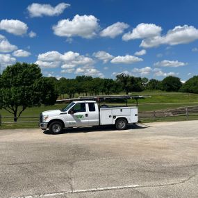 A Tioga Plumbing & Electric truck near Euless Texas at a golf course.